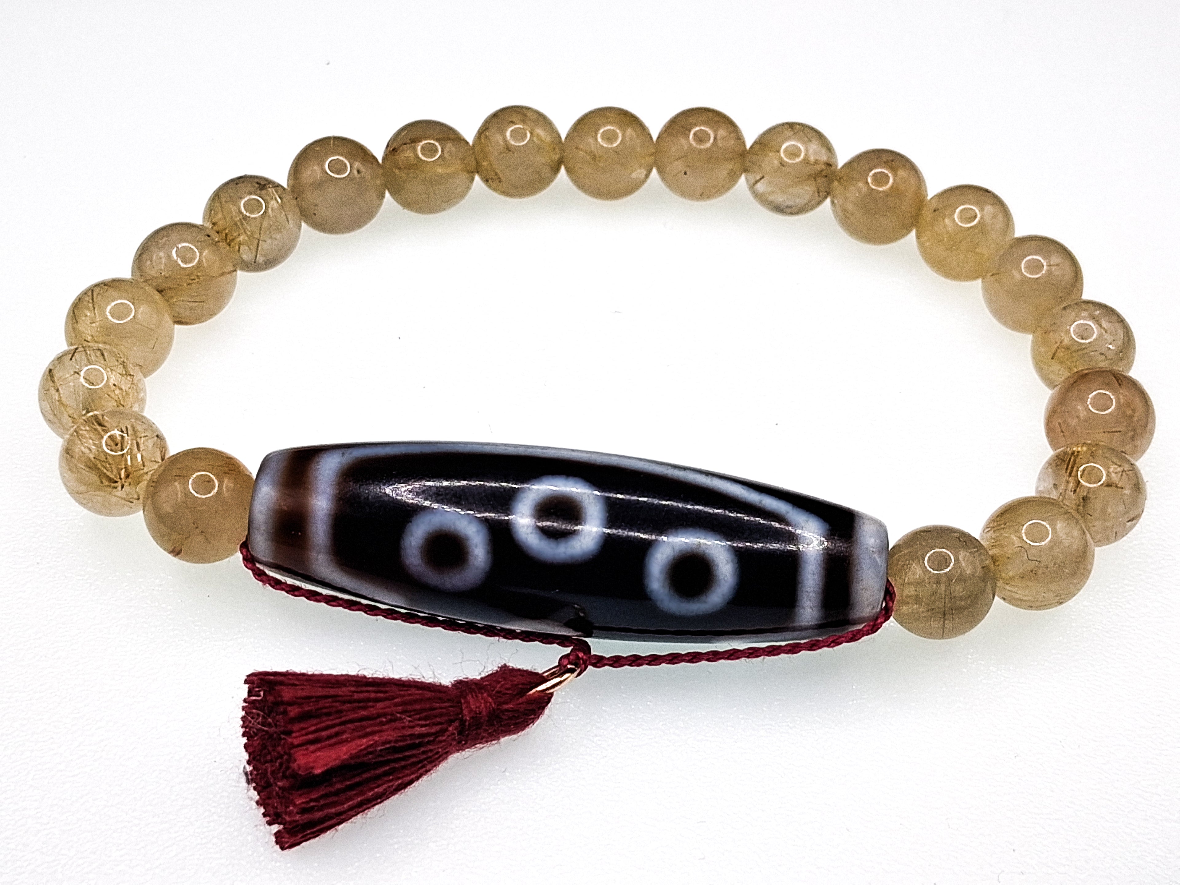 7-Eye Dzi — Rutilated Quartz Bracelet