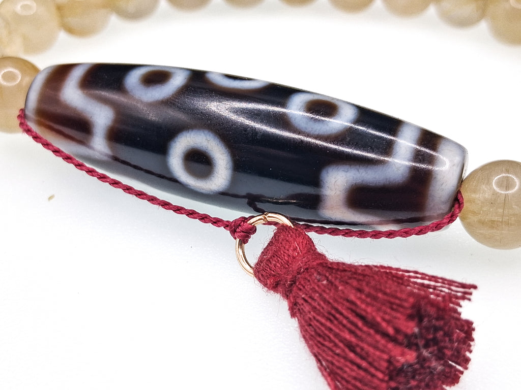 7-Eye Dzi — Rutilated Quartz Bracelet