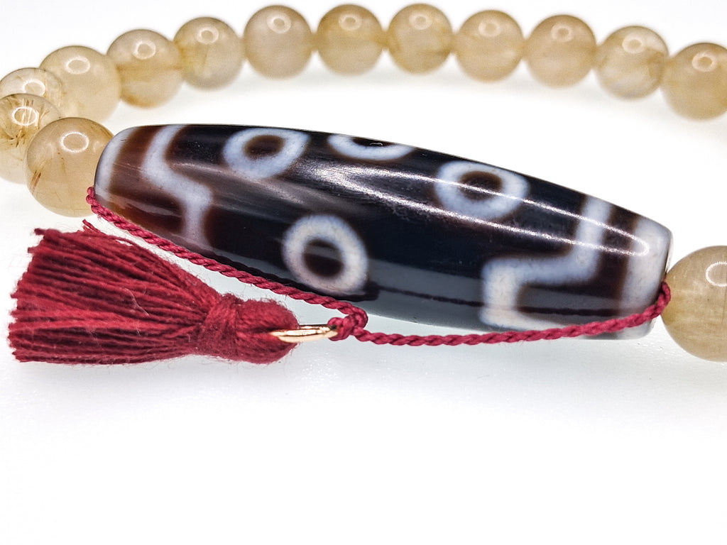 7-Eye Dzi — Rutilated Quartz Bracelet