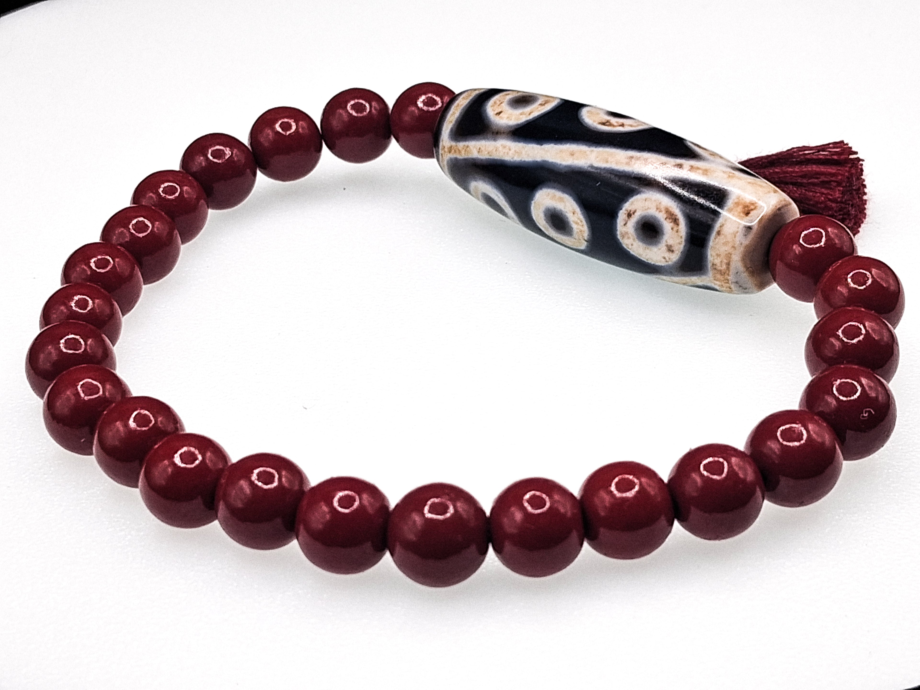 9-Eye Dzi with Da Luo Design — Cinnabar Bracelet