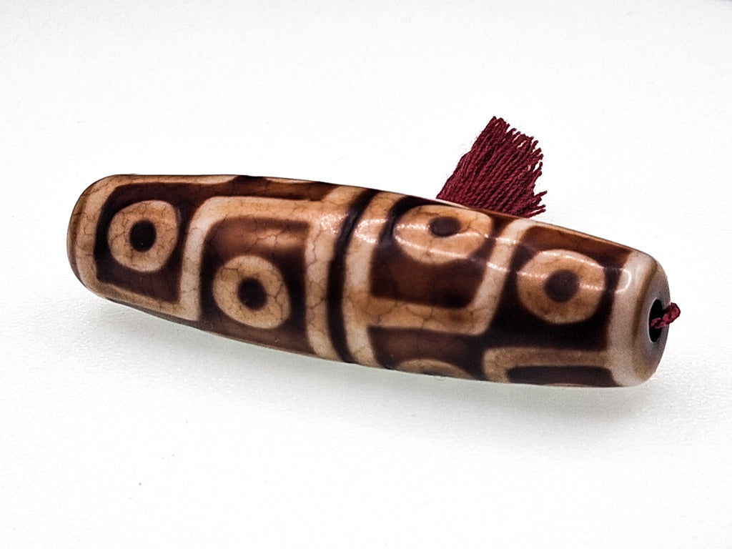 12-Eyed Buddha Dzi with Six Lightnings — The Stone of Power and Recognition