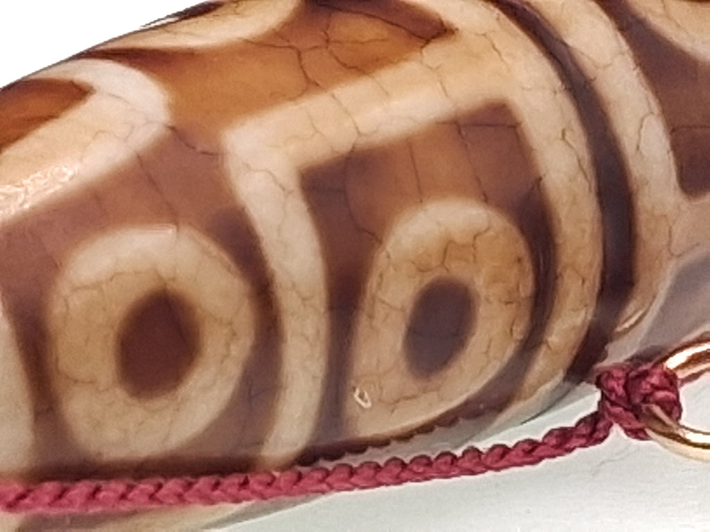 12-Eyed Buddha Dzi with Six Lightnings — The Stone of Power and Recognition